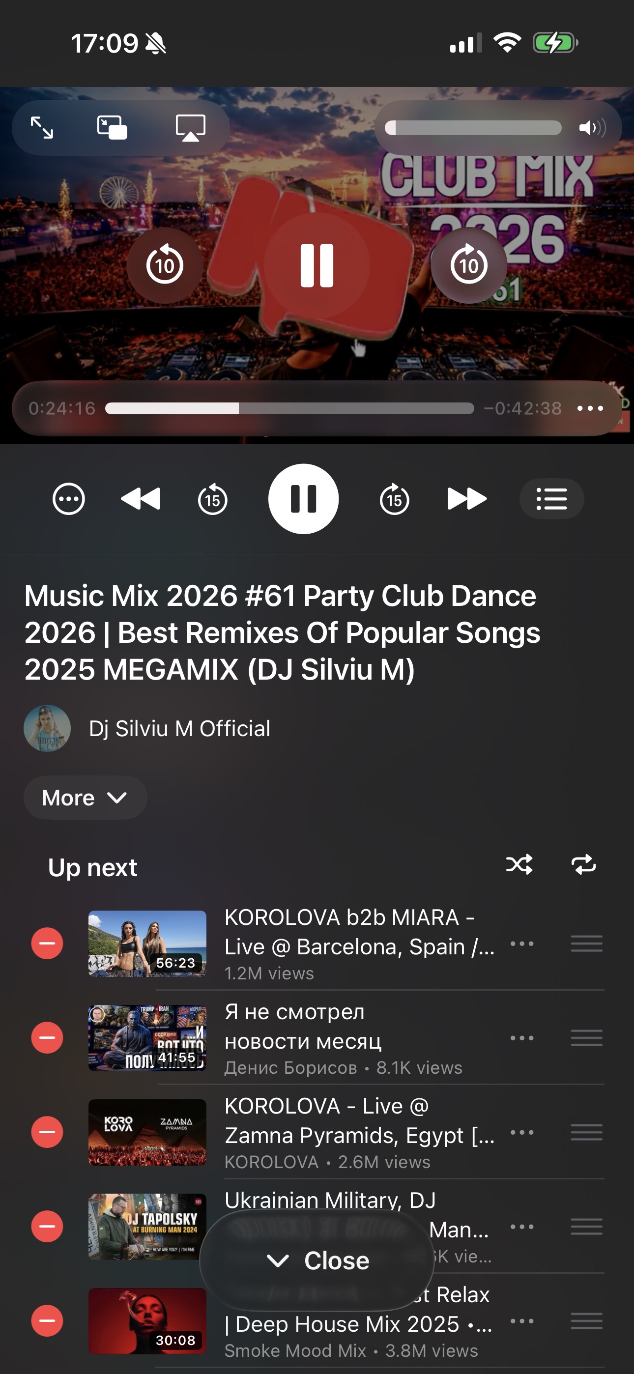 Native AVPlayer transport controls overlaid on a music video